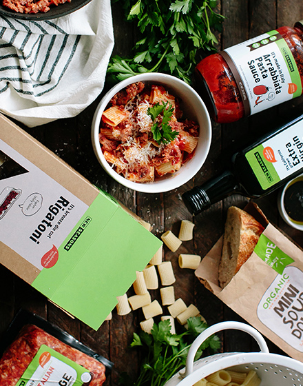 Packages of New Seasons Market Brand Items like pasta, sauce, and olive oil.